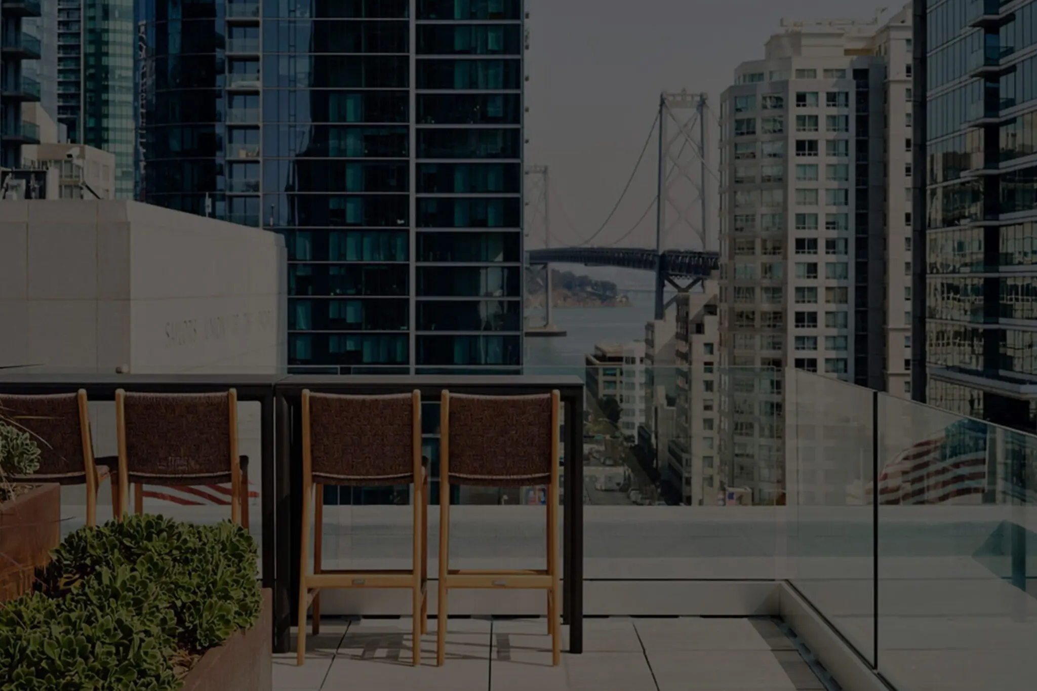 Rooftop terrace at Mill Creek apartment community with Bay Bridge views and upscale urban living amenities.